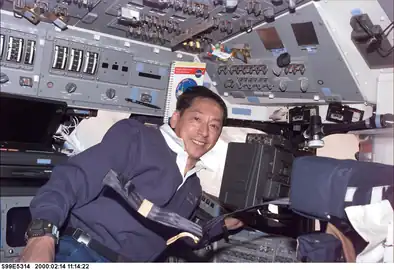 Astronaut Mamoru Mohri on Endeavour's flight deck during STS-99 Flight Day 4 of the Shuttle Radar Topography Mission (14 February 2000)