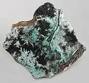 Plattnerite (white crystals)