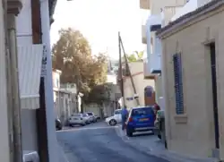 Ayioi Omoloyites Avenue, traditional thoroughfare of the old village. Note the narrowness of the street and traditional design of the houses