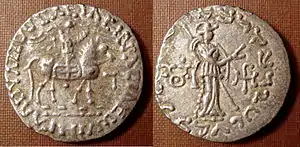 Silver coin of the Apracaraja Vijayamitra in the name of Azes II. Buddhist triratna symbol in the left field on the reverse. of Apracharajas