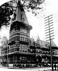 An ornate Victorian Gothic style building with a square tower