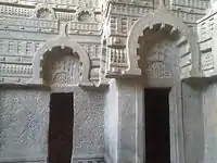 Peepal leaves on gavaksha arches