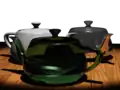 Utah teapots with ray-traced reflection and refraction