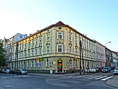 View of both facades from the street crossing