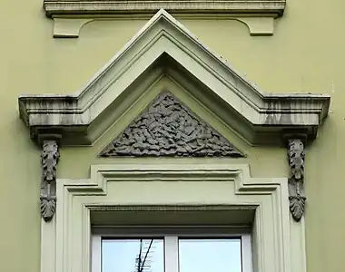 First floor decorated pediment