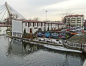 View of the complex from the bridge over the Brda river