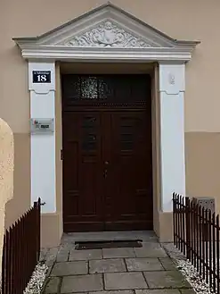 Ornamented gate and its pediment