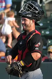 A baseball player in black and gray