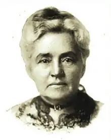 B&W portrait photography of an older woman with her hair in an up-do