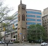 The 1889 bell tower from the former Bellefield Presbyterian Church is all that remains in front of the University of Pittsburgh's Bellefield Towers  building