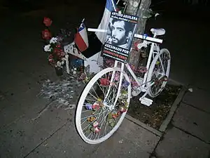 Ghost bike or "Bicianimita" in Chile, with a traditional small house for the soul of a traffic violence victim, 2013