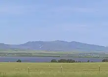 Canyon Ferry Lake in foreground as seen from U.S. Highway 12 near Townsend, Montana. Big Belt Mountains in background.