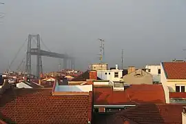 The bridge emerges from the fog, view from Portugalete.