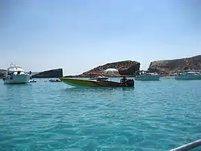 The Blue Lagoon at sea level with Cominotto in the background