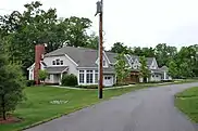 Two-story houses beside a driveway