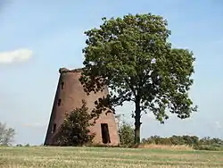 Ruined smock mill in the village