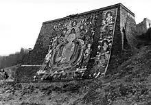 Huge thangka on thangka wall.