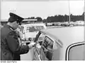 East German border guards checking vehicles at the checkpoint in Drewitz in March 1972 after the easing of travel restrictions into East Germany.