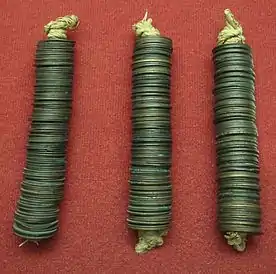 Bundles of 100 copper Mon coins; they were the official currency of Japan in the Muromachi period, from 1336 until 1870. These coins are from the Edo period.