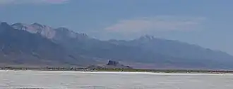 Flat expanse with a mountain range in the distance