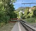 View NW from the MOB Fontanivent Station showing the remains of the line toward Blonay, now a siding, and the former alignment of track toward Clarens