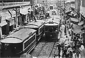 Tram on a busy city street