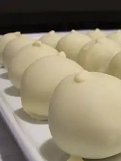 A plate of white chocolate cake balls