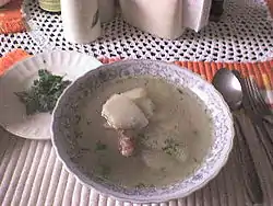 A caldo de costilla served hot and with cilantro leaves