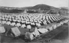 51st Iowa Volunteer encampment, Camp Merritt, 1898; with view of Lone Mountain Cemetery