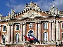 Front of ornate building with pillars