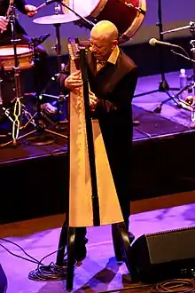 Carlos "Cuco" Rojas playing harp on a Cimarron performance