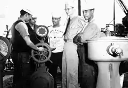 LT Carlton Skinner with several of his black crewmembers on Sea Cloud