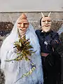 A bride and her groom in the carnival of Lazarim, Portugal