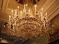 Chandelier at Chatsworth House fitted with light bulbs shaped like candle flames