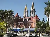 Hotel by the Chapala Malecon, with St. Francis of Assisi Church in background