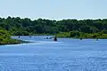 Boaters in Charles River adjacent to park