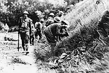 Troops of the 2nd Battalion, 16th Infantry Regiment, 1st Infantry Division (United States) digging in behind a railroad embankment just north of Chaudun, 18 July 1918, during the Battle of Soissons