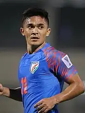 Portrait of Sunil Chhetri in blue shirt.