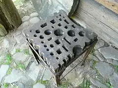 A large Polish swage block, mounted on a pedestal