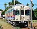 Set 2002 in August 2010 in Aeon advertising livery with KuHa 2502 leading