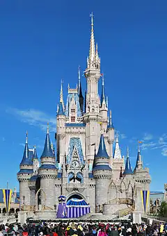 Blue and white castle with the bottom layer being made of stone bricks