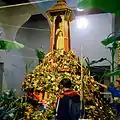 Flowers are offered to the city pillar during the Inthakin Festival in Chiang Mai