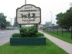 Clarkson Village welcome sign, at Lakeshore Road West and Inverhouse Drive.