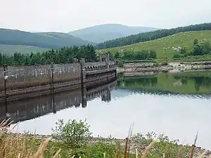 A lake surrounded by hills