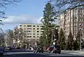 Streetscape with cars and tall apartment buildings