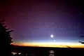 The tail of the comet Comet McNaught was still seen in the Northern hemisphere after the comet itself was long gone. The picture also shows the Moon and Venus.