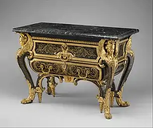 Commode; by André Charles Boulle; c. 1710–1732; walnut veneered with ebony and marquetry of engraved brass and tortoiseshell, gilt-bronze mounts, antique marble top; 87.6 x 128.3 x 62.9 cm; Metropolitan Museum of Art