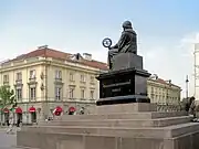 Inscription in Polish on west face of pedestal: "To Mikołaj Kopernik [from his] compatriots".