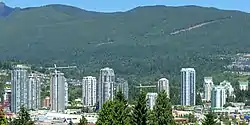 Skyscrapers in the Town Centre area of the city of Coquitlam, with the North Shore Mountains in the background.