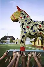 Dala horse in front of the 1904 World's Fair Swedish Pavilion, in Lindsborg, Kansas